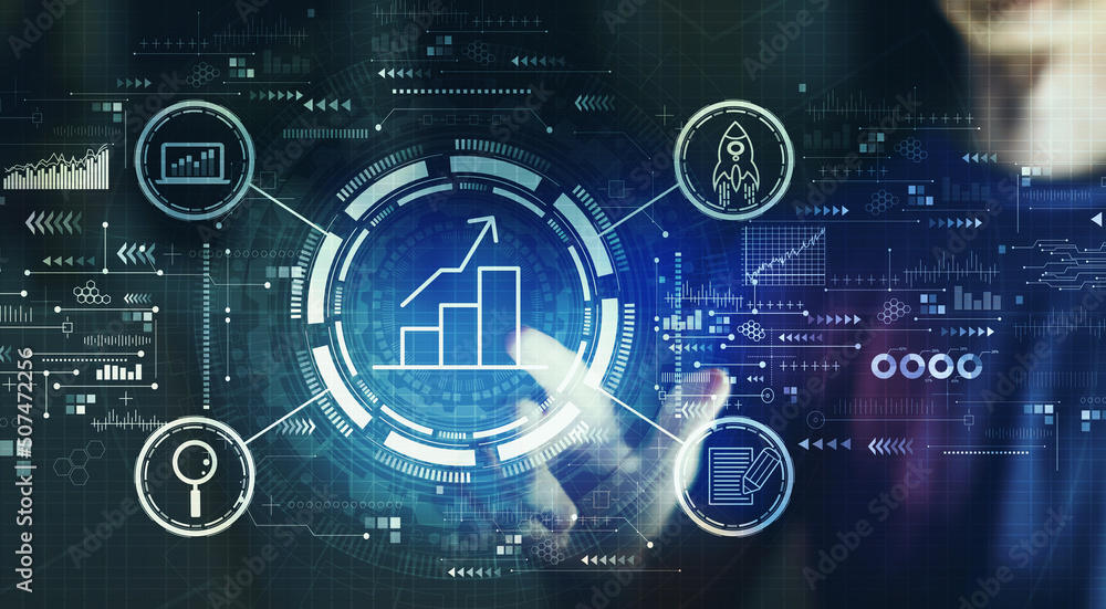 Business growth analysis with young man touching a digital screen at night Business growth analysis with young man touching a digital screen at night
