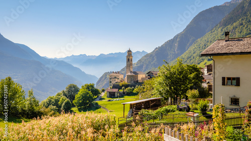Nice autumn view on the gorgeous village of Soglio, located on the mountainside on the northern side of the Val Bregaglia (Grisons, Switzerland). In the background lies the Italian border.