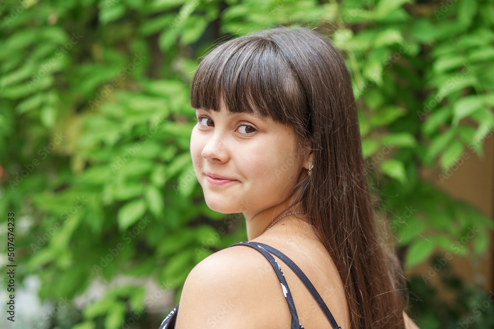 Portrait of beautiful brunette teen girl with very long hair. Summer season. Portrait of beautiful brunette teen girl with very long hair. Summer season.