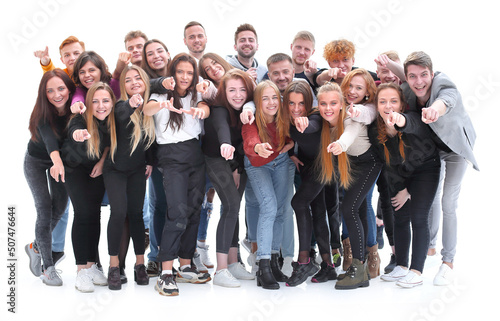 team of cheerful young people pointing at you