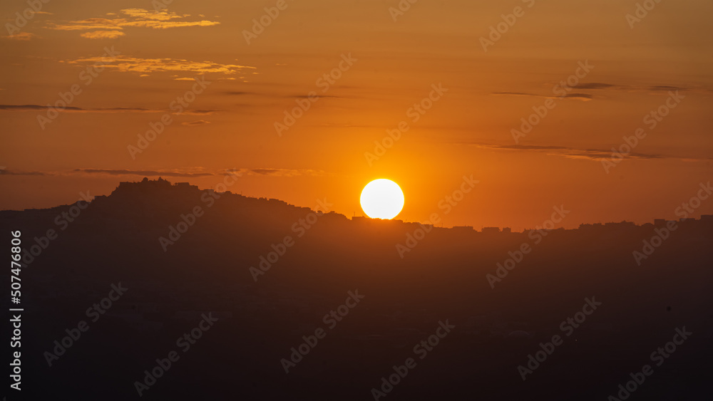 Sunrise on Santorini island over the town of Akrotiri