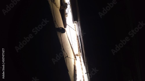 Old houses in narrow alley, movint through street in city of Damascus, Syria