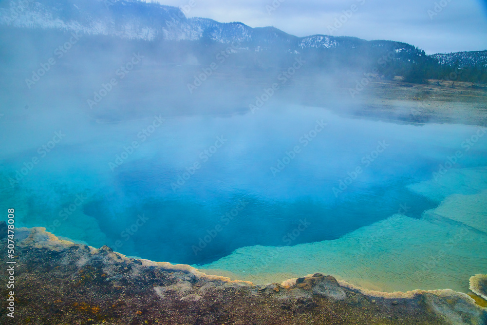 Huge blue pool emits sulfur steam in Yellowstone basin Huge blue pool emits sulfur steam in Yellowstone basin