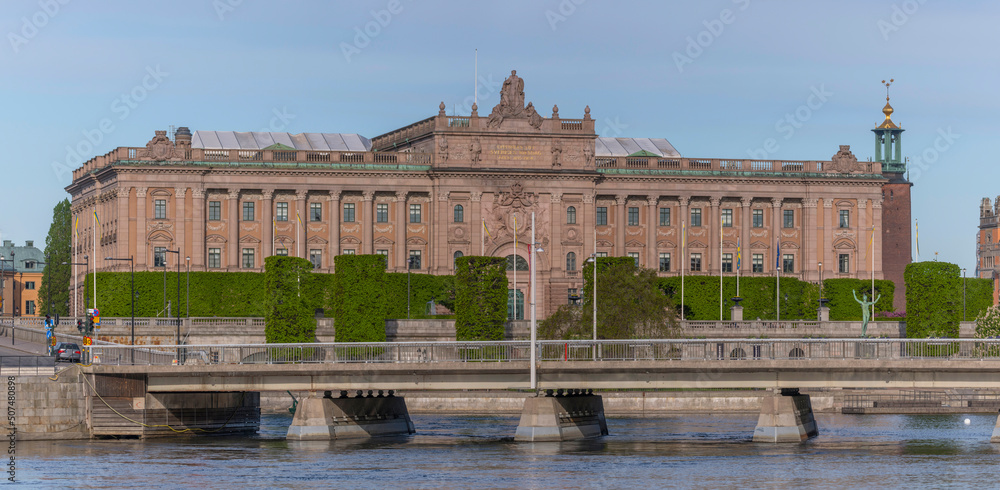 The parliament building with the Town City Hall in the background a sunny summer day in Stockholm
