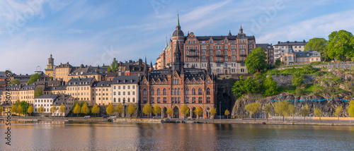 Photography Old houses on a hill in the district Södermalm with tin roofs and dorms a sunny