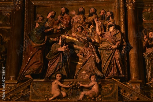 Empty coffin of Mary surrounded by twelve amazed apostles their hands raised, part of the main altar at Santa María de la Asunción basilica by Juan Bautista Vázquez and co-workers, Arcos, Spain photo