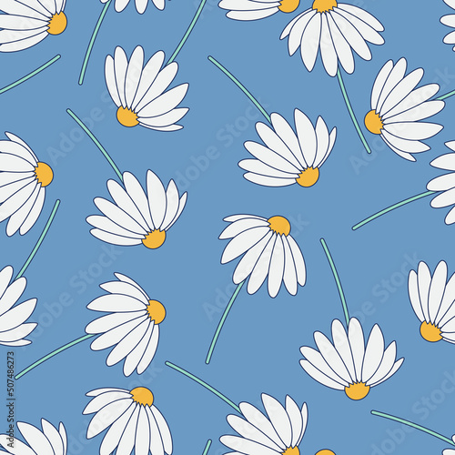 Seamless pattern with randomly arranged white flowers, daisies on a blue background.