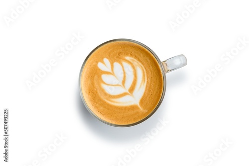 Flat white coffee in a transparent cup without a saucer. White background. Drawing on coffee.