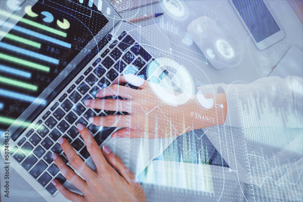 Double exposure of woman hands working on computer and data theme hologram drawing. Top View. Technology concept. Double exposure of woman hands working on computer and data theme hologram drawing. Top View. Technology concept.