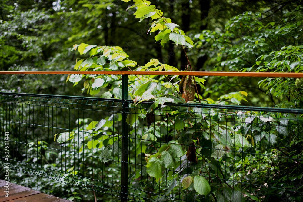 An old suspension bridge over a stormy river. An old suspension bridge over a stormy river.