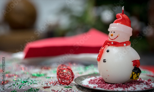 christmas decoration with snowman and candle