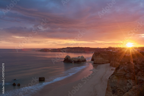 Sunset over the Praia do Amado on Algarve coast, Portugal. Long exposure shot