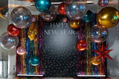 New Year's Eve photo area at the party. Lots of colorful helium balloons.