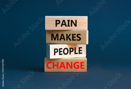 Pain makes people change symbol. Concept words Pain makes people change on wooden blocks on a beautiful grey table grey background. Business, motivational and pain makes people change concept.