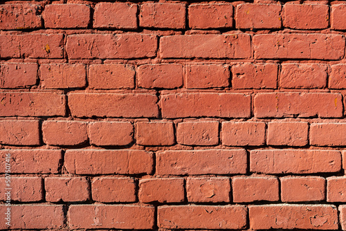 solid wall of red brick laid horizontally
