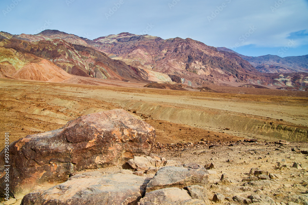 Desert landscape with colorful mountains in background
