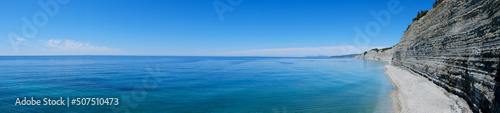 blue sea and sky. Idyllic, picturesque view of the seascape, rocky coast, top view. Good for background. copy space
