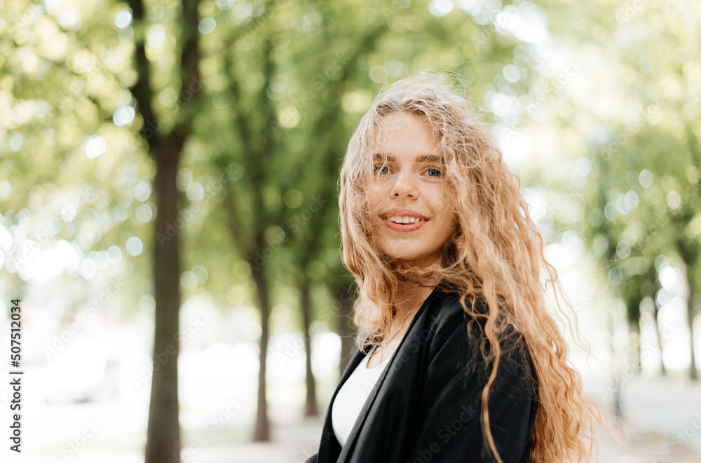 Portrait of a blonde woman with her hair flying in the wind Portrait of a blonde woman with her hair flying in the wind