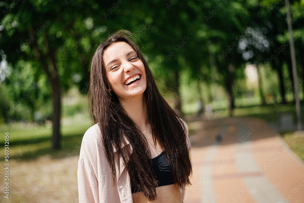Portrait of a laughing woman in the park Portrait of a laughing woman in the park