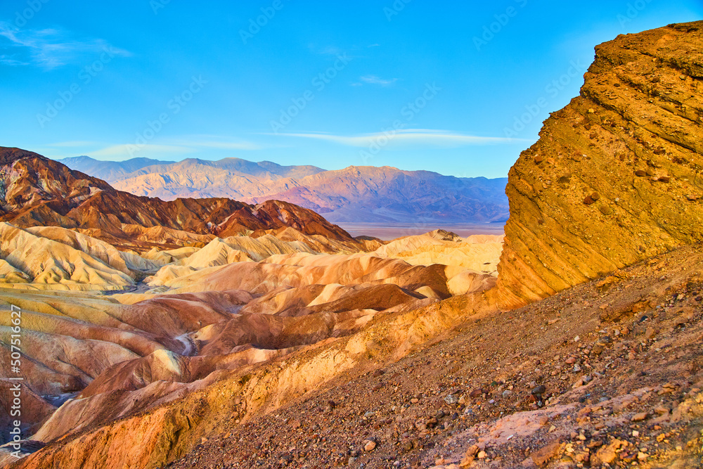 Cliffs leading to colorful sunrise views at Zabriskie Point in Death Valley