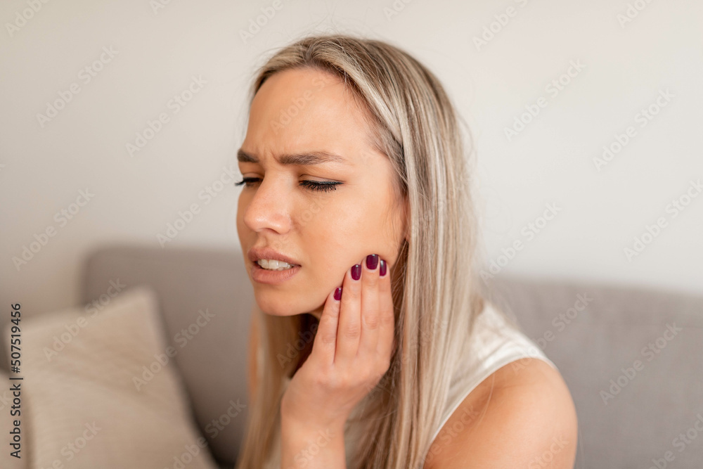 Teeth Problem. Woman Feeling Tooth Pain. Closeup Of Beautiful Sad Girl Suffering From Strong Tooth Pain. Attractive Female Feeling Painful Toothache. Dental Health And Care Concept. High Resolution Teeth Problem. Woman Feeling Tooth Pain. Closeup Of Beautiful Sad Girl Suffering From Strong Tooth Pain. Attractive Female Feeling Painful Toothache. Dental Health And Care Concept. High Resolution
