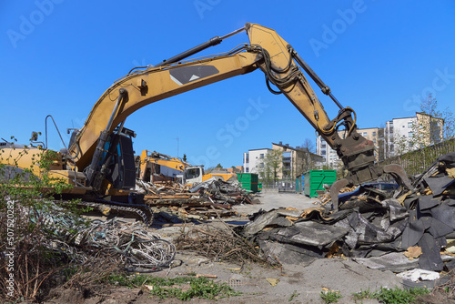 Construction site, building demolition, construction trash and construction machinery in European Finland.