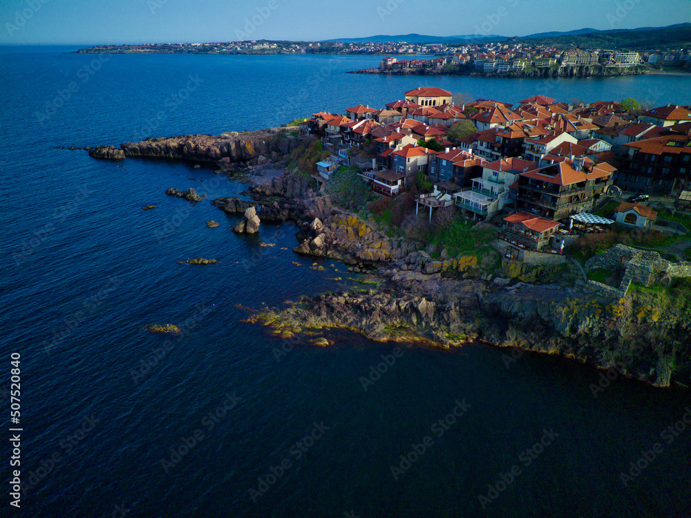 Fototapeta premium iew from a height of the city of Nessebar with houses and parks washed by the Black Sea in Bulgaria