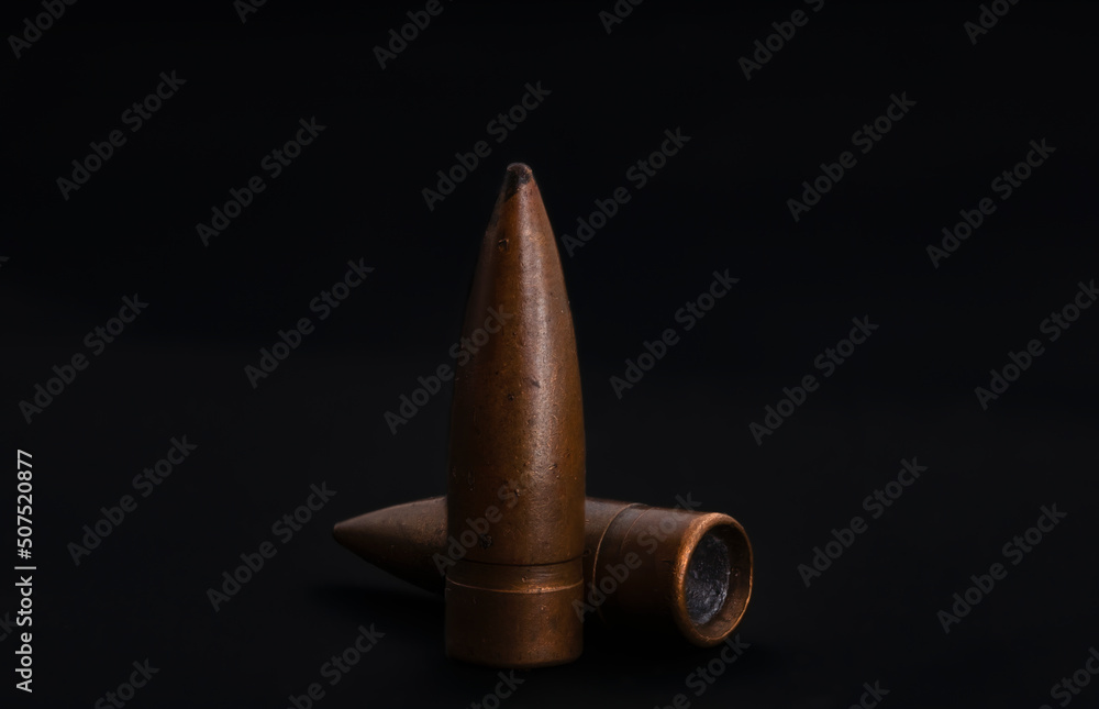 macro shoot of 7.62 caliber bullet on a black isolated background macro shoot of 7.62 caliber bullet on a black isolated background