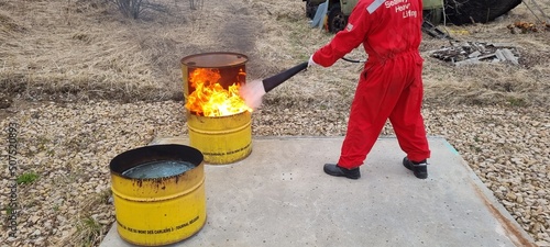 Delegates do practical exercises during a training session on fire fighting
