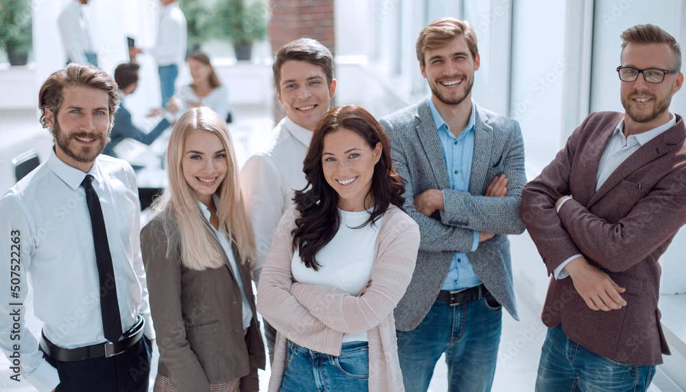 team of successful young employees standing in the office