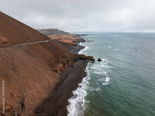 Aerial Icelandic landscape at Ketubjorg in the evening dusk. Cloudy coastline, ocean and grassland. Peninsula Skagi photo