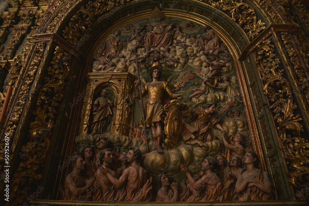 Wood carved Baroque marvel, Altar of Souls at Iglesia de San Miguel church, depicting Archangel Michael, master of salvation of souls from purgatory, St. Peter to the left, Jerez de la Frontera, Spain
