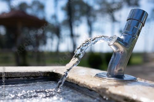 Fototapeta Naklejka Na Ścianę i Meble -  A small fountain of fresh and clean water for drinking in Georgia.
