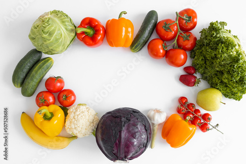 Frame of fresh vegetables and fruits isolated on white background