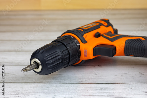 Cuadro en lienzo Cordless combo drill for used as normal drill, impact drill on wooden background