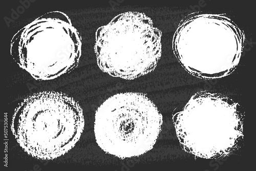 Set of chalk hand drawn circles, round design elements on black board. Abstract freehand  white spots.  Isolated circle shape as blank stamp, seal, frame, grunge background. 