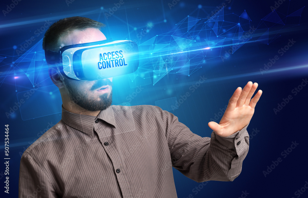 Businessman looking through Virtual Reality glasses, virtual security concept Businessman looking through Virtual Reality glasses, virtual security concept