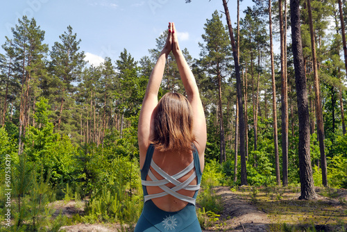 Woman practicing yoga at the nature