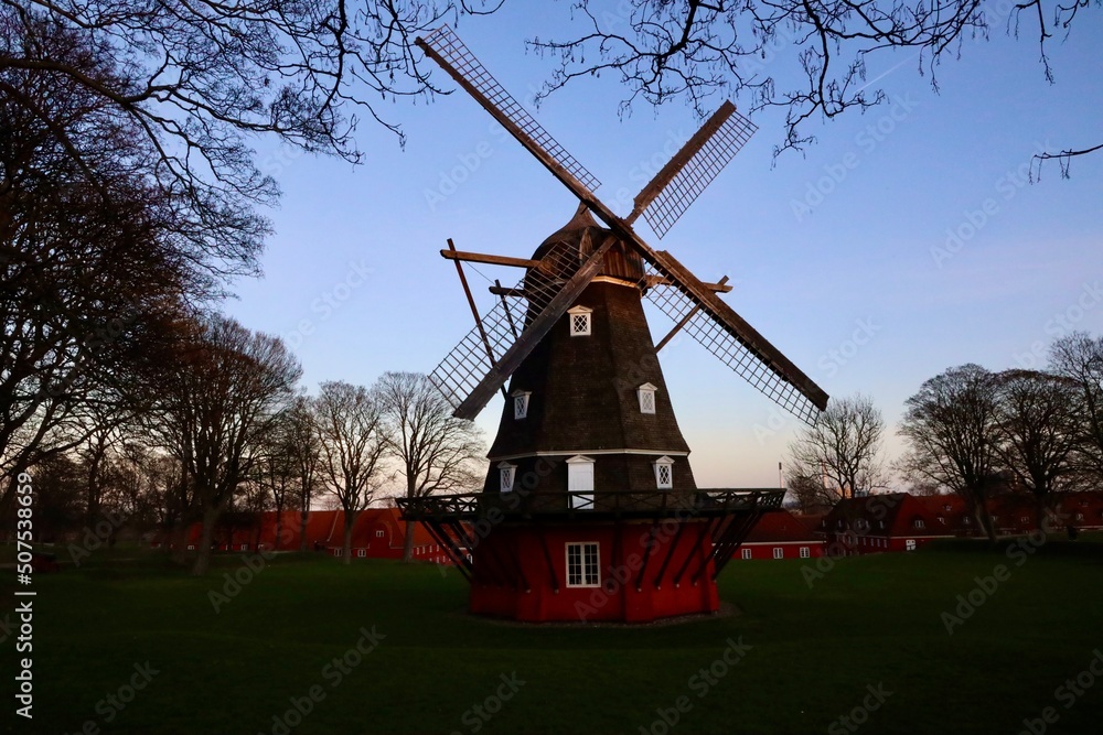 Obraz premium dutch windmill at sunset in Copenhagen Denmark