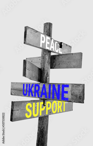 Wooden road sign with words peace  Ukraine  support  hunger 