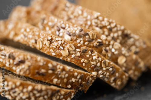 Sliced whole grain bread with oat flakes. Wholemeal bread.