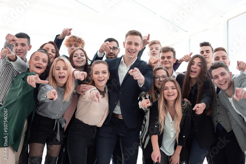 group of ambitious young professionals pointing at the camera