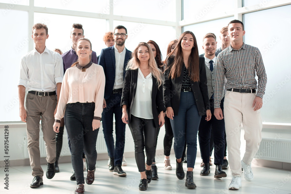 young business people walking together in a new office