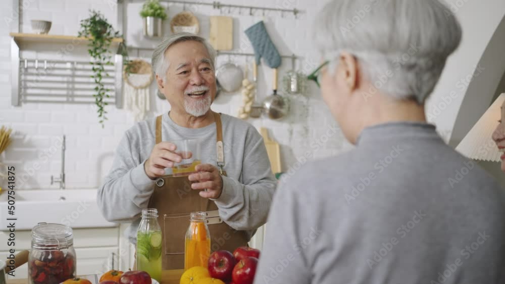 Group of Asian senior people friends making fruit juices for friends to drink in kitchen.colorful fruits and vegetables. Healthy eating Group of Asian senior people friends making fruit juices for friends to drink in kitchen.colorful fruits and vegetables. Healthy eating