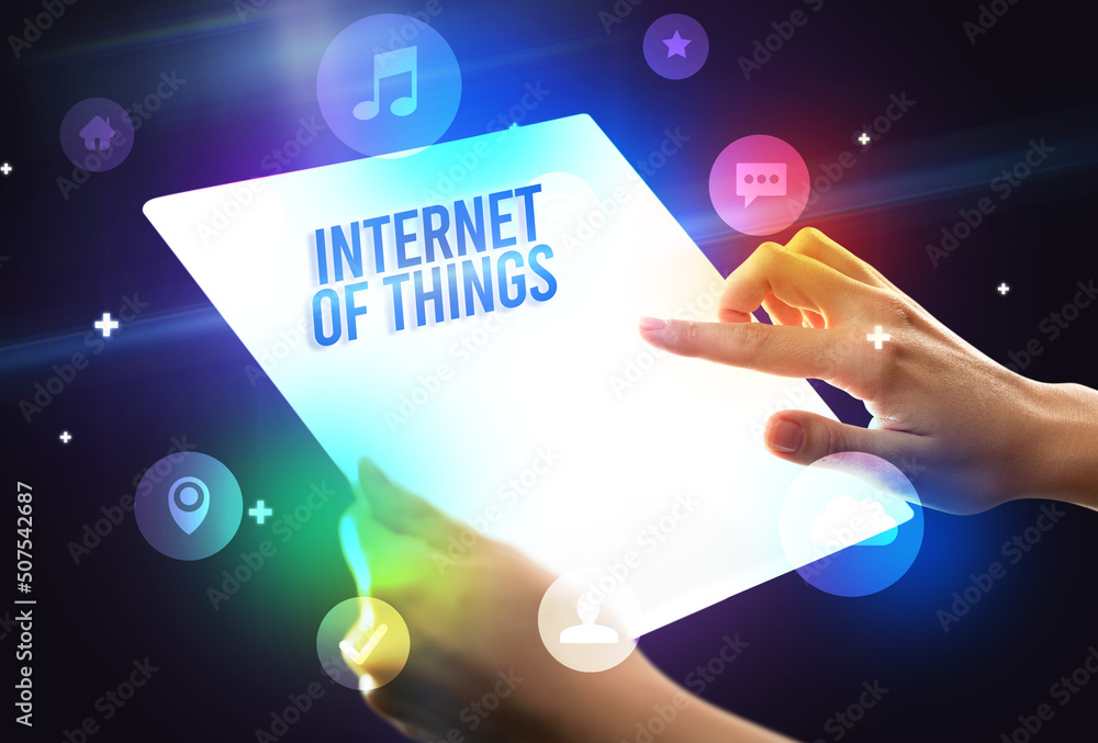 Holding futuristic tablet, new media concept Holding futuristic tablet, new media concept