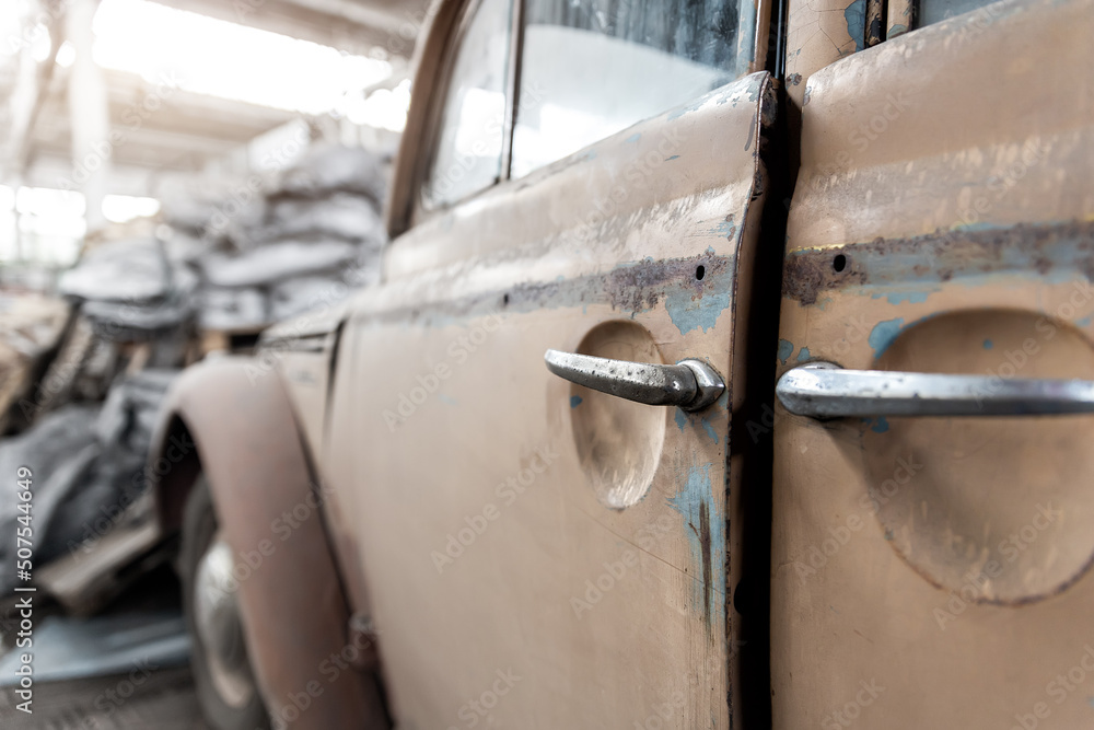 Closeup detail rusty abandoned forgotten antique oldtimer old car