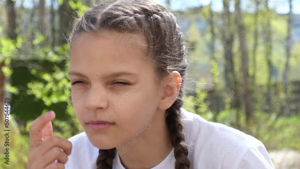 cute teenage girl squints because of poor eyesight street, child with poor eyesight selection of glasses to improve vision cute teenage girl squints because of poor eyesight street, child with poor eyesight selection of glasses to improve vision