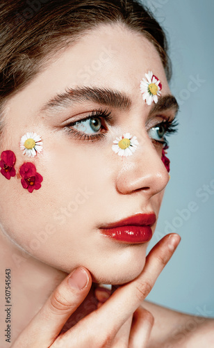 Beautiful fashion model portrait, spring make up style with flowers, soft aesthetic look