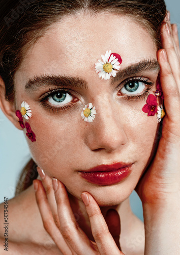 Beautiful fashion model portrait, spring make up style with flowers, soft aesthetic look