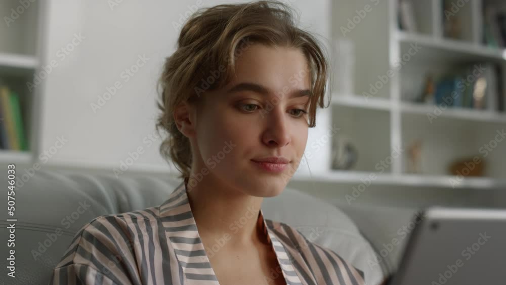 Girl making video call in living room closeup. Beautiful lady holding tablet. Girl making video call in living room closeup. Beautiful lady holding tablet.